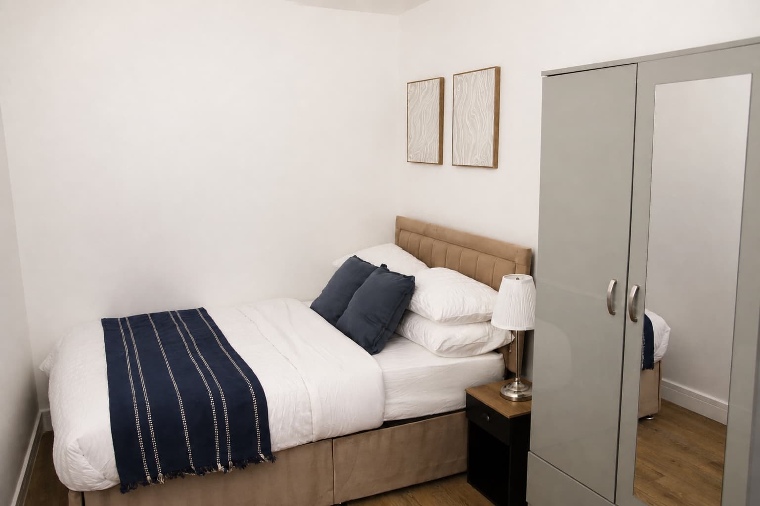 Double bedroom with wardrobe and bedside table