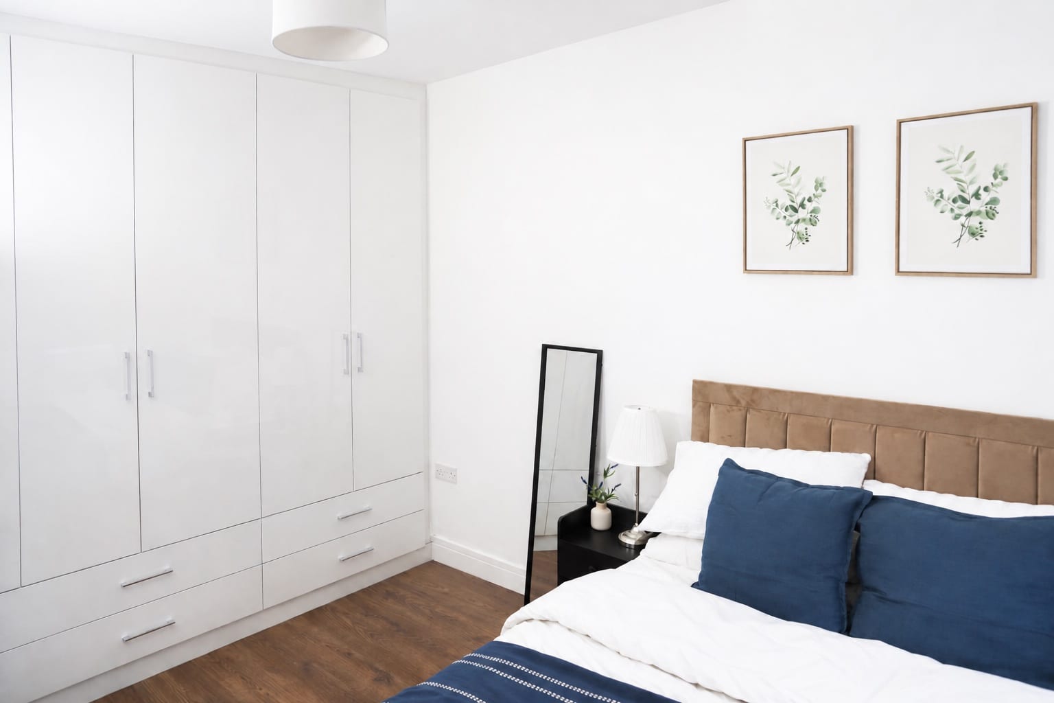 Illustrative bright bedroom with practical storage