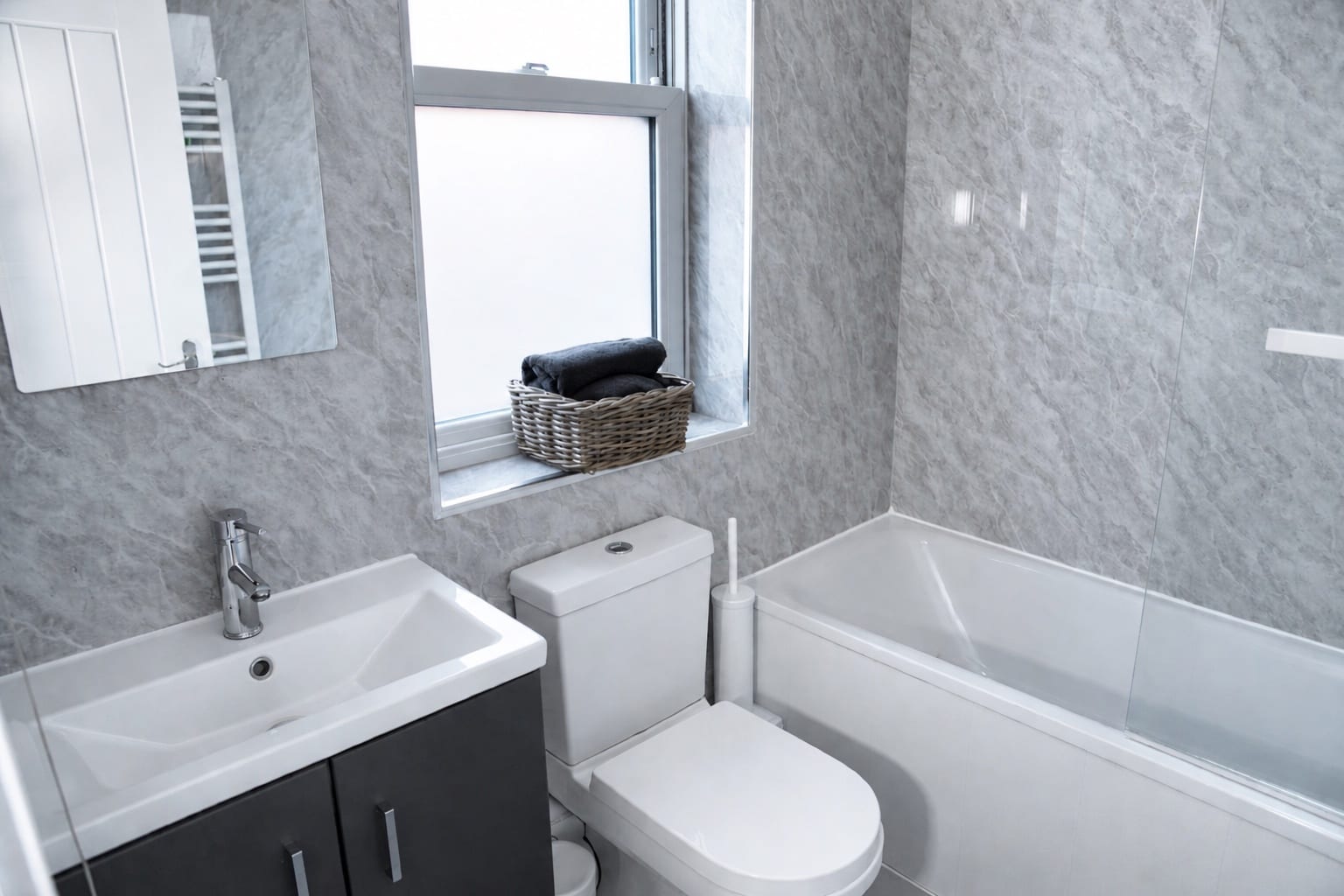Illustrative clean bathroom with a bath and vanity